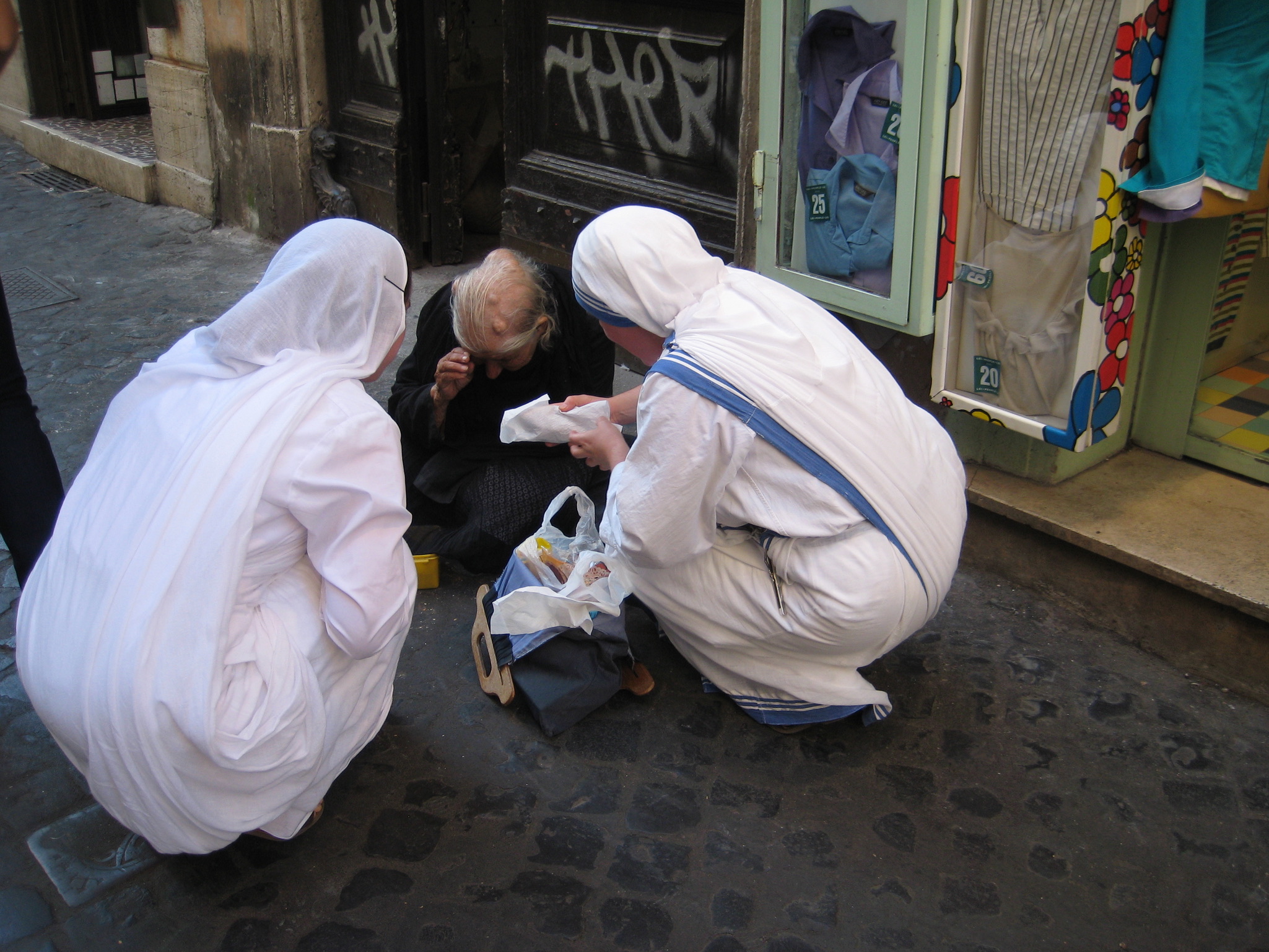 Who is my neighbor? Missionaries of Charity care for homeless man on streets of Rome. 2010