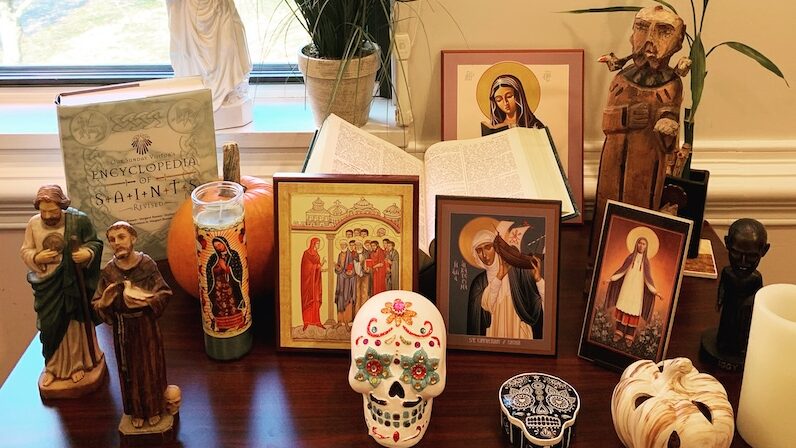 Saint statues and Day of the Dead skull